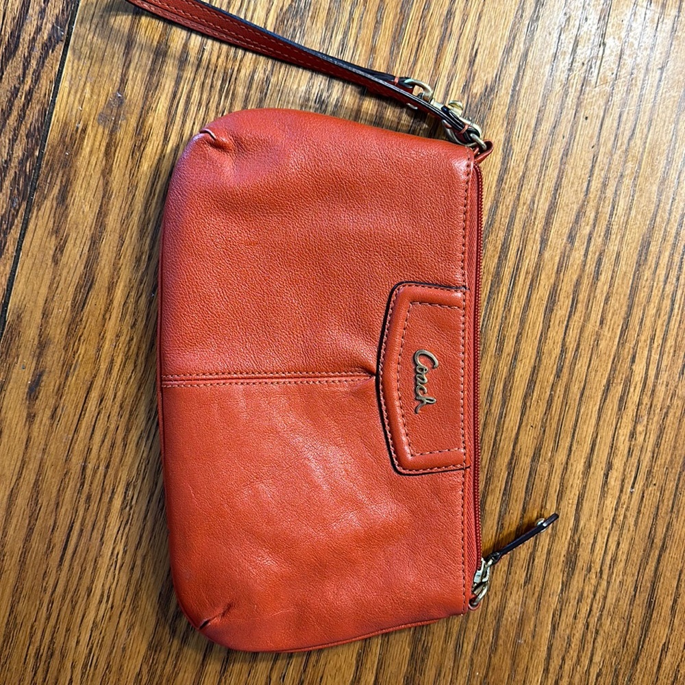 Coach wristlet burnt orange color